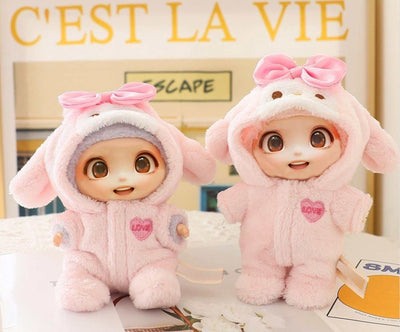 Two LABUBU dolls wearing pink plush doll clothes outfits with bows and heart patches