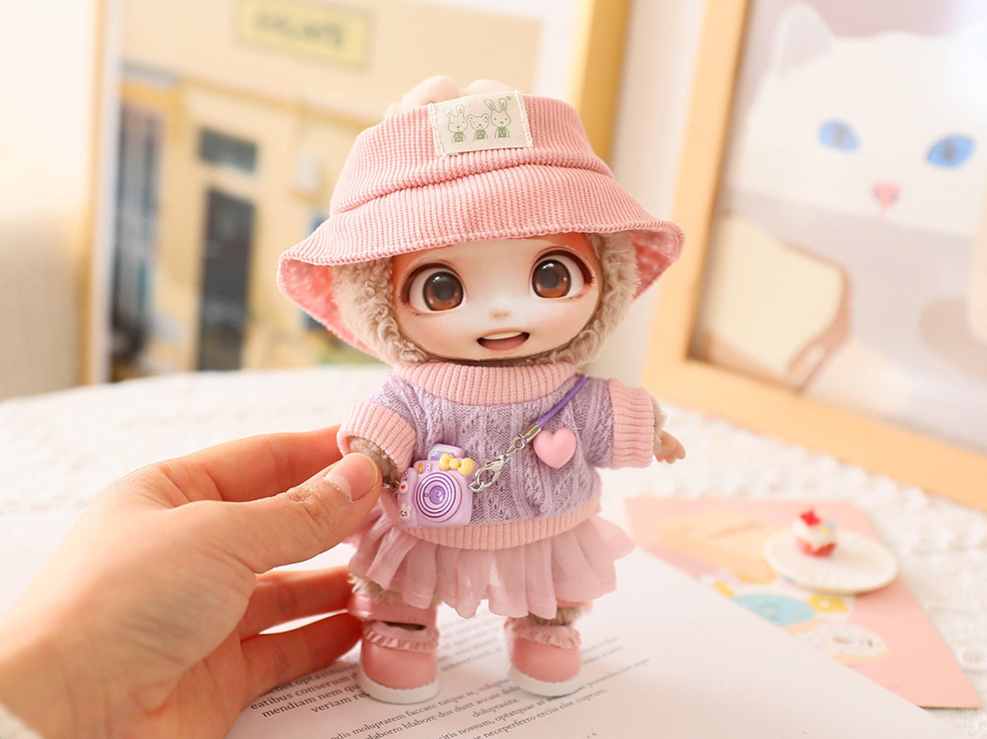 Cute doll wearing pink hat, shoes, and purple outfit held in hand, dress-up accessory for 15cm-17cm LABUBU dolls