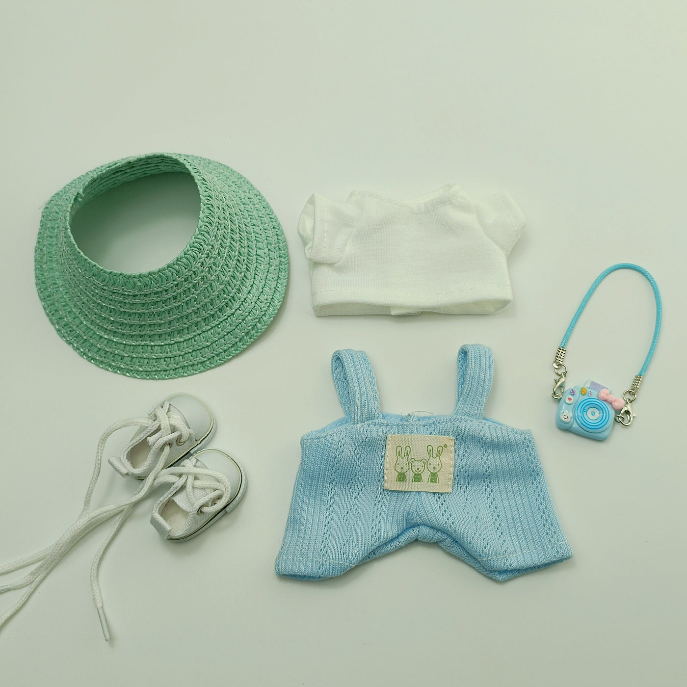 Cute hat shoes and doll clothes outfit set with blue knitted dress, white shirt, green hat, white shoes, and miniature camera accessory for LABUBU dolls.