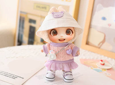 Adorable LABUBU doll dressed in pastel pink and purple outfit with cute white hat and matching shoes accessory set